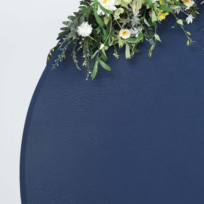 Navy blue round table with floral arrangement on top