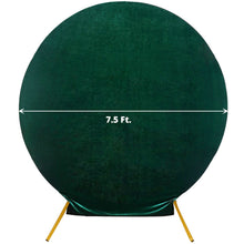 A hunter emerald green velvet circle that is 7.5 ft in diameter