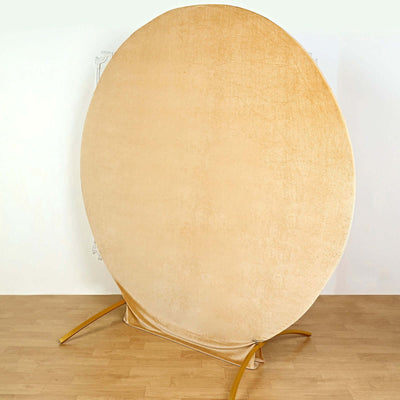 Round golden backdrop with a stand for photography.