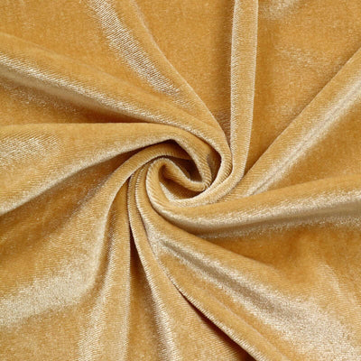 Golden velvet fabric with a soft, luxurious sheen.