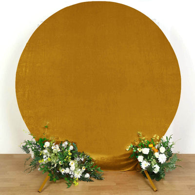 Gold circular backdrop with floral arrangements at the base.