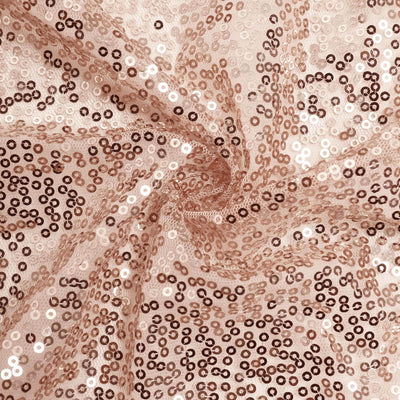 Rose gold sequin fabric showcasing intricate details and shimmer.