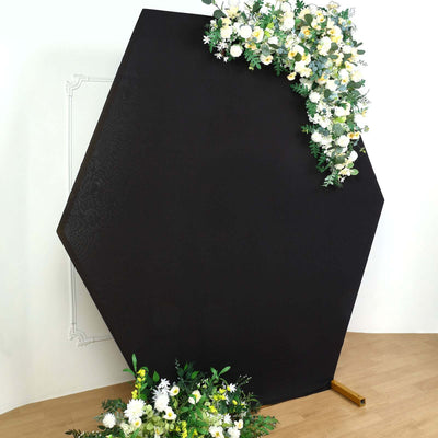 Hexagonal backdrop with floral arrangement for events or photography.