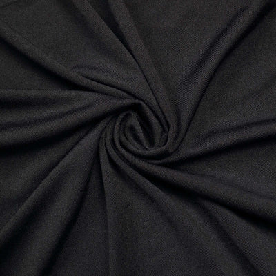 Black fabric texture in a swirling pattern.
