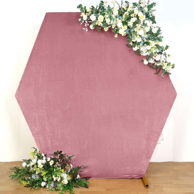 Hexagon backdrop in soft blush with floral accents for events and photography.