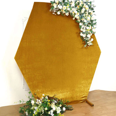 Hexagon backdrop in mustard yellow with floral arrangement.