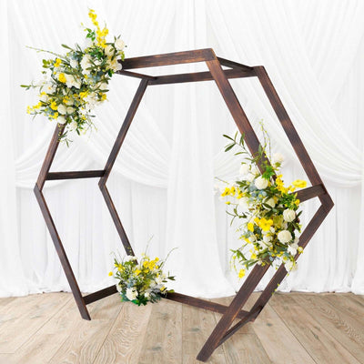 Hexagon flower stand with yellow and white blooms on a wooden base.