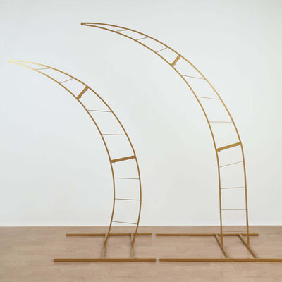 Gold arch display stands in two sizes on a plain background.