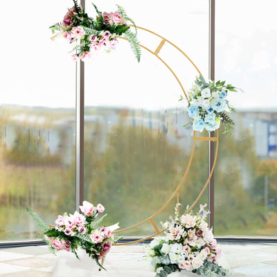 Floral arch decor with pink and blue flowers in a bright indoor setting.