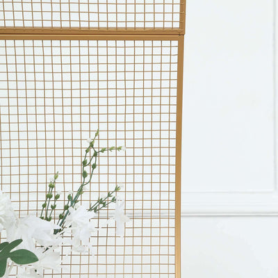 Gold wire grid display with white flowers