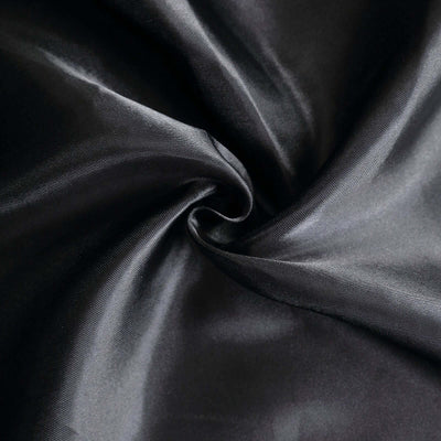 Black satin fabric showing smooth texture and sheen.