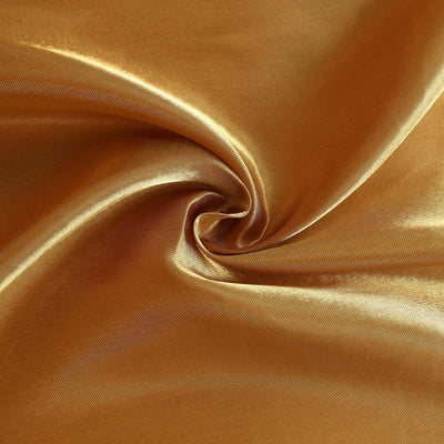 Shiny gold fabric with smooth texture and elegant drape.