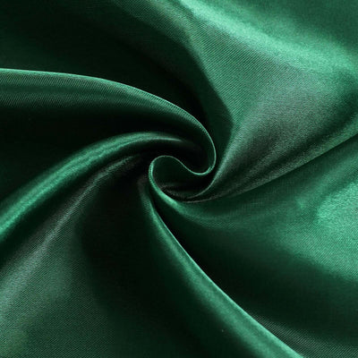 Luxurious deep green satin fabric, showcasing smooth texture and rich color.