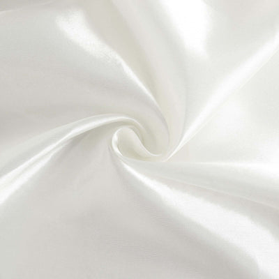 Glossy white satin fabric swirl texture close-up.