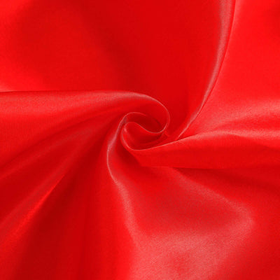 Red satin fabric texture close-up showing smooth and shiny surface details.