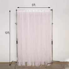 Sheer blush tulle curtain being measured at 5 ft and 10 ft