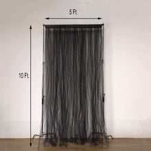 Sheer black tulle and satin curtain being measured at 5 ft and 10 ft