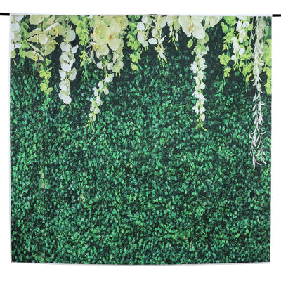 Artificial green foliage backdrop with white floral accents.