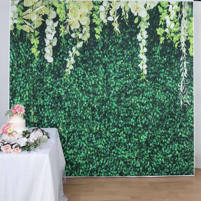 Wedding decor backdrop with greenery and floral arrangements.