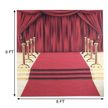 A Vinyl Red Carpet leading to a stage with gold rope barriers