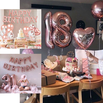 Birthday celebration setup with balloons, cake, and decorations.