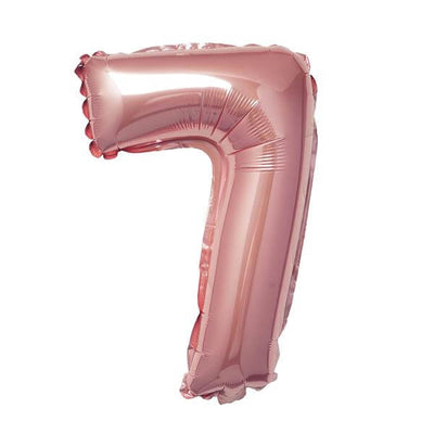 Rose gold number 7 balloon on a plain background