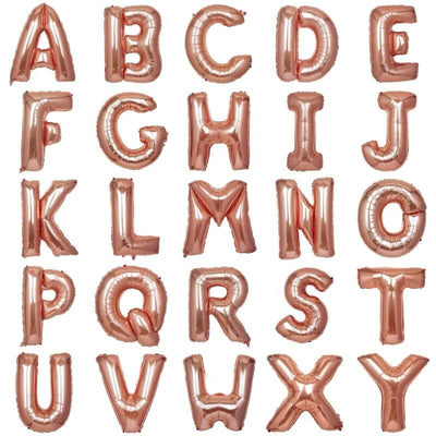Rose gold alphabet balloons in A-Z arrangement on white background