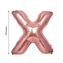 A rose gold Mylar Foil balloon in the shape of the letter X
