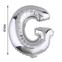 A silver Aluminum Foil balloon in the shape of the letter G