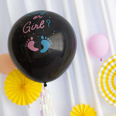 Black gender reveal balloon with pink and blue footprints design.