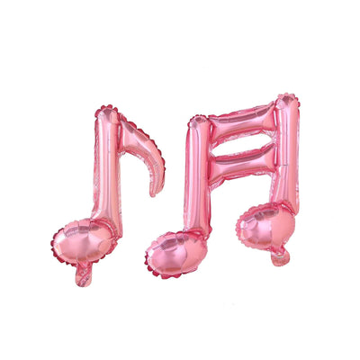 Pink musical note balloons on a plain background