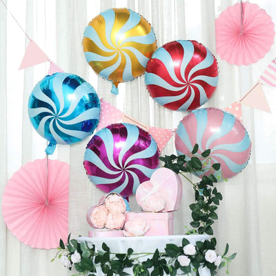 Colorful swirl balloons and decorative fans at a festive celebration scene.