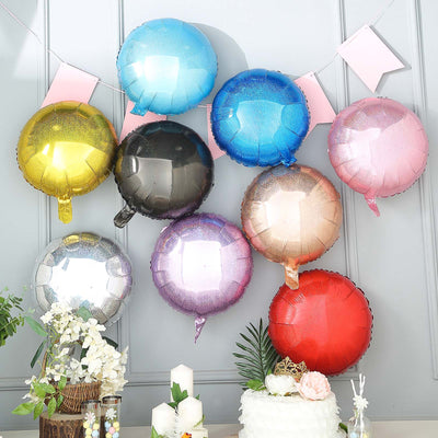 Colorful metallic balloons arranged on a wall for a festive celebration.