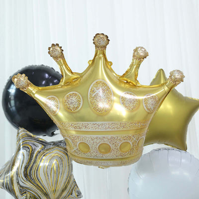 Gold crown-shaped balloon with decorative details and surrounding star balloons.
