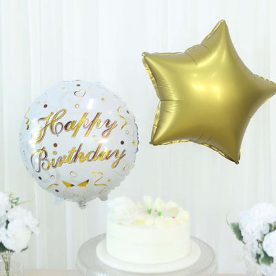 Happy Birthday balloons with a cake in a festive setting.
