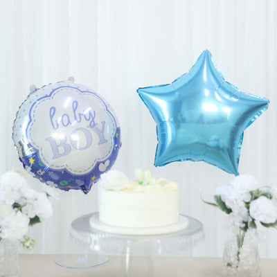 Baby boy balloons in blue with a cake and flowers in a celebratory setting.