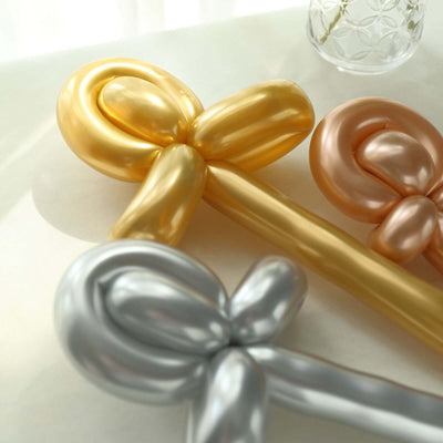 Colorful balloon decorations in gold, silver, and rose gold.