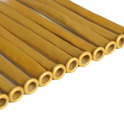 Yellow rubber tubing cutouts arranged in a row.