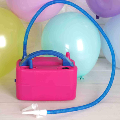 Pink balloon pump with blue hose, surrounded by colorful balloons.
