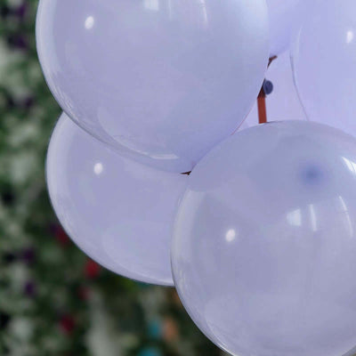 White balloons clustered together against a blurred background.
