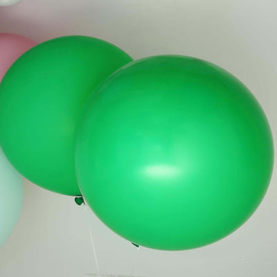 Two large green balloons floating together.
