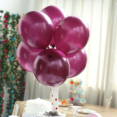 Purple balloons arranged in a decorative display for a celebration.