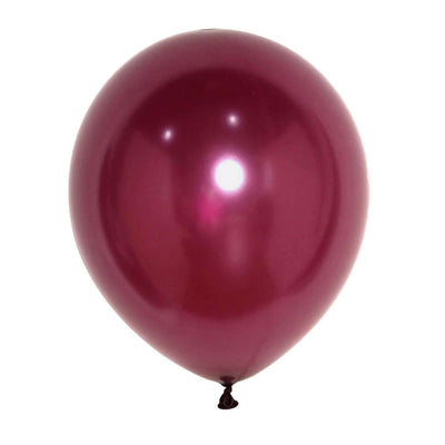 Shiny magenta balloon on a plain background