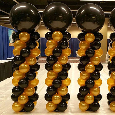 Black and gold balloon column decoration for events and parties.