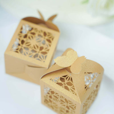 Elegant gold laser-cut gift boxes with butterfly accents.