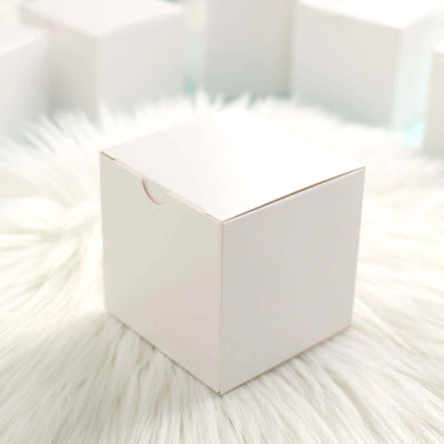 White square packaging box on a soft white background.