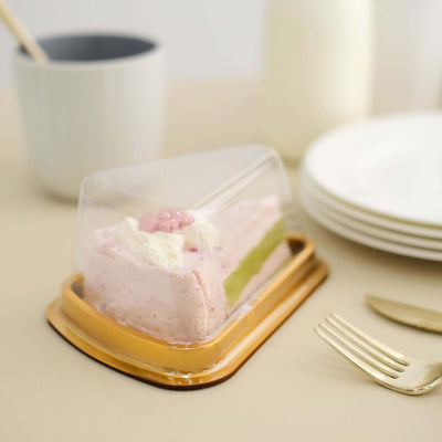 Strawberry mousse cake in clear packaging on a beige surface.