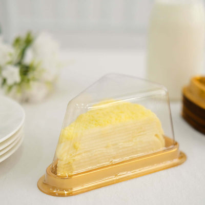 Layered cake in transparent packaging on a table setting.