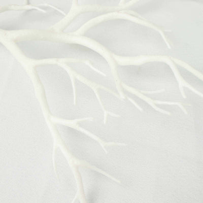 White decorative branch with intricate details on a plain background.