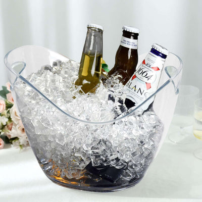 Clear ice bucket filled with ice and beer bottles.